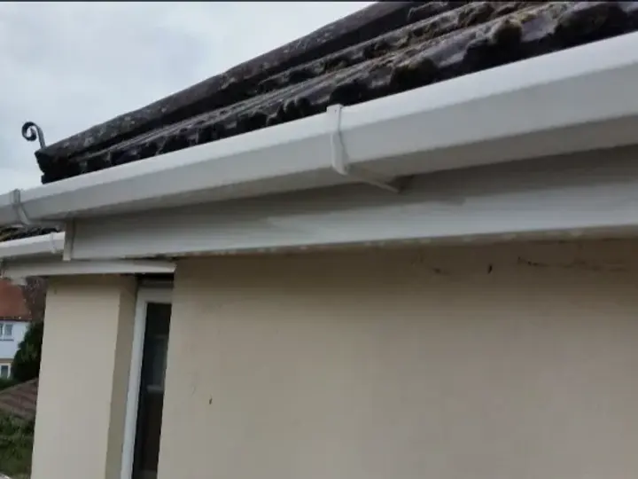 The same gutter and fascia white again after cleaning